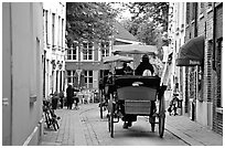 Horse carriage in a narrow street. Bruges, Belgium ( black and white)