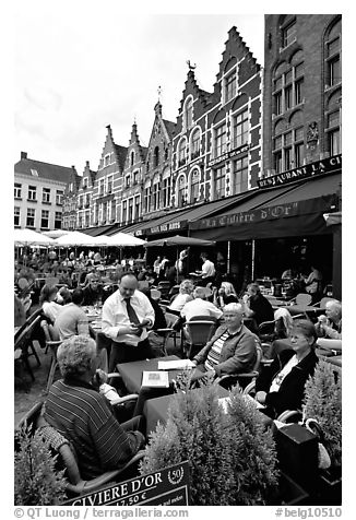 People in restaurants on the Markt. Bruges, Belgium (black and white)