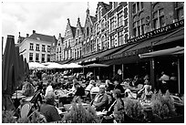 People in restaurants on the Markt. Bruges, Belgium (black and white)