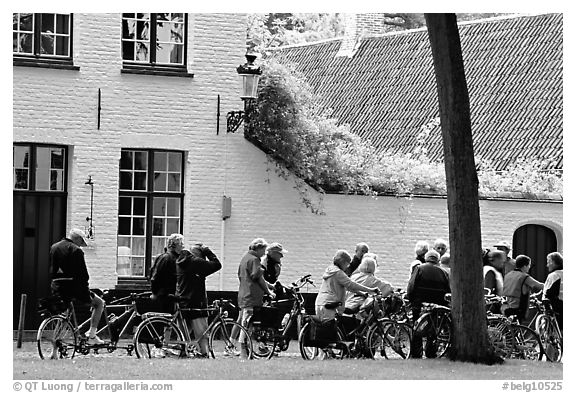 Bicylists in Courtyard of the Begijnhof. Bruges, Belgium (black and white)