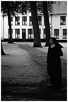 Benedictine nun in the Begijnhof. Bruges, Belgium ( black and white)