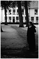 Benedictine nun in the Begijnhof. Bruges, Belgium (black and white)