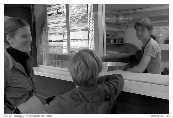 Women at a fries booth. Bruges, Belgium (black and white)