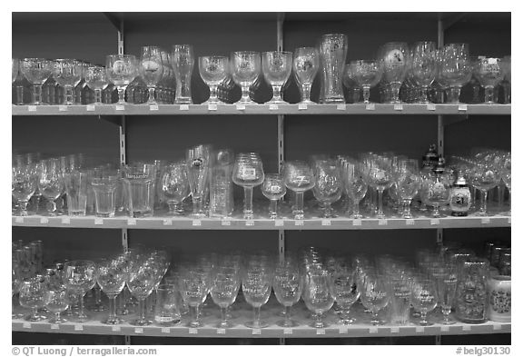 Large variety of glasses used to drink specific beers. Bruges, Belgium (black and white)
