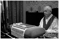 Priest and relic of Christ's blood. Bruges, Belgium (black and white)