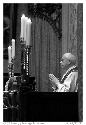 Priest in the the Basilica of Holy Blood. Bruges, Belgium