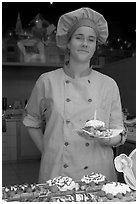 Vendor holding a Belgian waffle. Brussels, Belgium ( black and white)