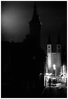 Rathaus and Neumunsterkirche seen fron Alte Mainbrucke (bridge) at night. Wurzburg, Bavaria, Germany ( black and white)
