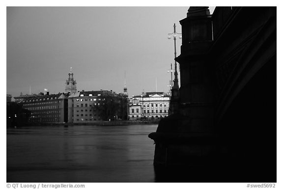 Bridge on Riddarfjarden and Gamla Stan, midnight twilight. Stockholm, Sweden (black and white)