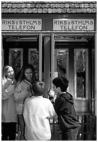 Swedish kids in a phone booth. Stockholm, Sweden ( black and white)