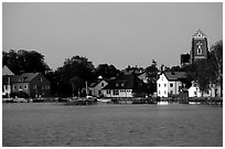 Houses, church, across the lake at dusk, Vadstena. Gotaland, Sweden (black and white)