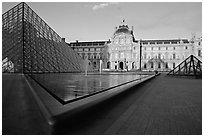 Pyramid and basins, and Sully Wing  in the Louvre, sunset. Paris, France ( black and white)