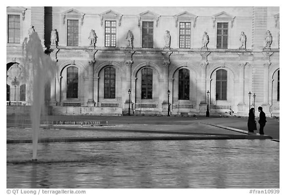 Basin and projected shadow of the Pei pyramid on the Louvre at sunset. Paris, France (black and white)