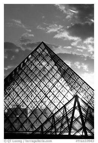 Louvre pyramid transparent at sunset. Paris, France (black and white)