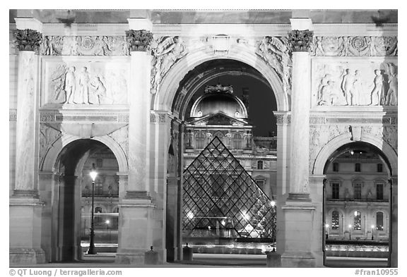 Arche de triomphe du Carousel, Louvre, and Pyramid at night. Paris, France (black and white)