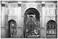 Arche de triomphe du Carousel, Louvre, and Pyramid at night. Paris, France ( black and white)