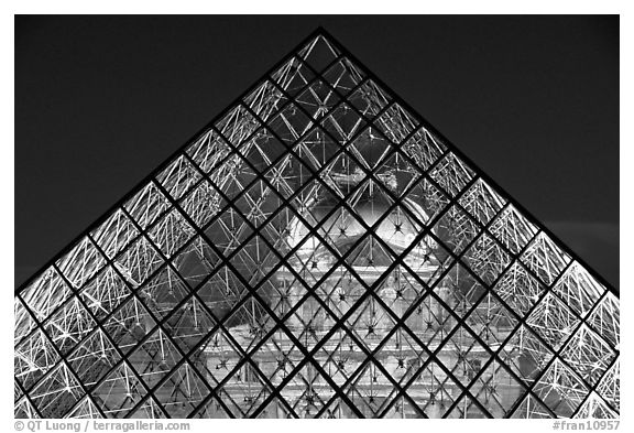 Louvre seen through pyramid at night. Paris, France