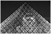 Louvre seen through pyramid at night. Paris, France (black and white)