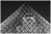 Louvre seen through pyramid at night. Paris, France ( black and white)