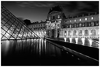 Basin, Pyramid, and Louvre at dusk. Paris, France (black and white)