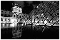 Louvre, Pyramid, basin,  at night. Paris, France ( black and white)