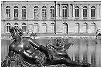 Statue, basin, and facade, afternoon, Palais de Versailles. France (black and white)