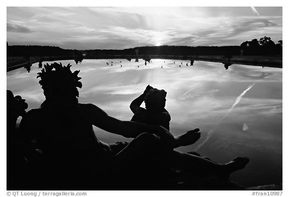 Sculpture and basin at sunset, Versailles Palace. France