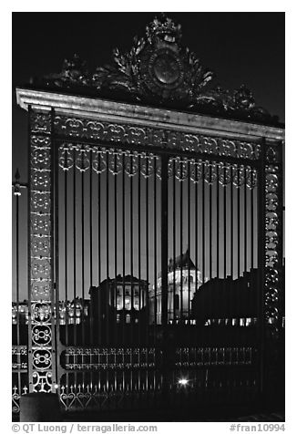 Versailles Palace gates at night. France (black and white)
