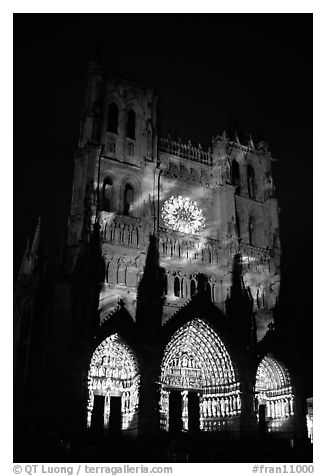 Cathedral facade illuminated at night, Amiens. France