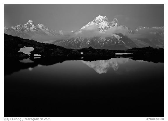 Aiguille Verte reflected in pond at dusk, Chamonix. France (black and white)