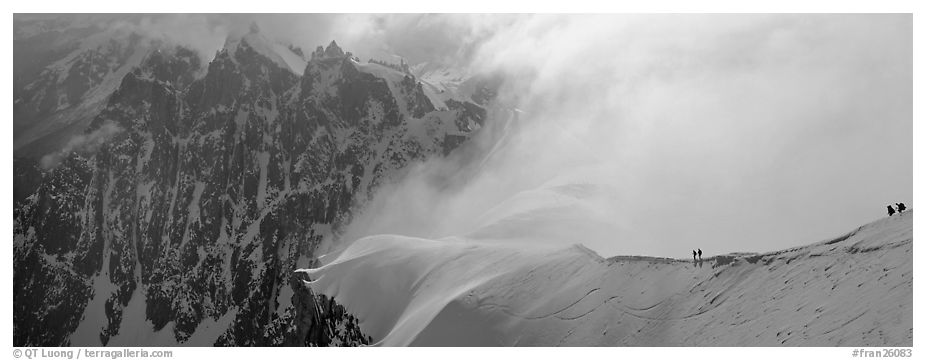 Ridge with alpinists and high peaks. France (black and white)