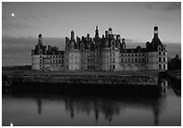 Chambord chateau at dusk with moonrise. Loire Valley, France (black and white)