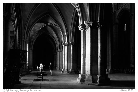 Worshiper inside the Saint-Etienne Cathedral. Bourges, Berry, France