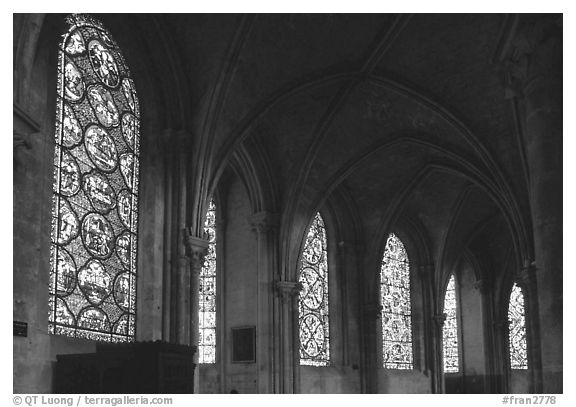 Aisle with tained glass windows, Saint-Etienne Cathedral. Bourges, Berry, France