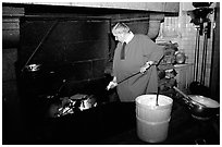 Baking the famous Omelette de la mere Poularde at the eponymous restaurant. Mont Saint-Michel, Brittany, France ( black and white)