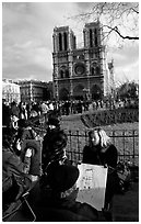 Sketch drawers in front of Notre Dame Cathedral. Paris, France ( black and white)