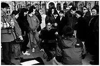 Sketch drawer surrounded by onlookers. Paris, France ( black and white)