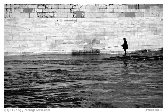 Fishing in the Seine River. Paris, France (black and white)