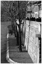Walking on the banks of the Seine on the Saint-Louis island. Paris, France (black and white)