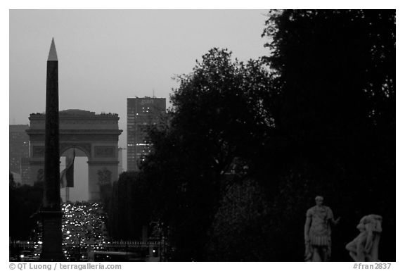 Obelisk of the Concorde and Arc de Triomphe at sunset. Paris, France