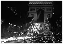 Arc de Triomphe and Champs Elysees at night with car light trails. Paris, France (black and white)