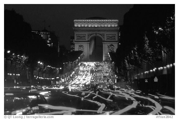 Arc de Triomphe and Champs Elysees at night. Paris, France (black and white)
