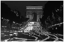 Arc de Triomphe and Champs Elysees at night. Paris, France (black and white)