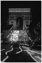 Arc de Triomphe and lights of cars on Champs Elysees. Paris, France (black and white)