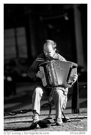 Accordeon player on the street. Paris, France (black and white)