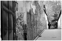 Boy in side alley with graffiti on walls. Paris, France (black and white)