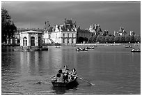 Rowers and Fontainebleau palace. France (black and white)