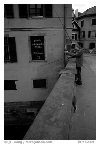 Fishing in a canal. Strasbourg, Alsace, France