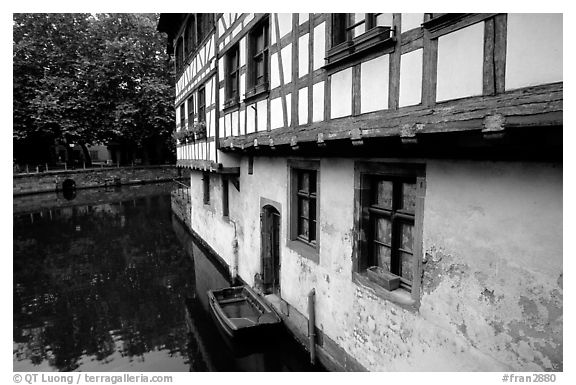 Half-timbered houses next to a canal. Strasbourg, Alsace, France (black and white)