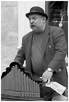 Street musician with Barrel organ. Quartier Latin, Paris, France (black and white)